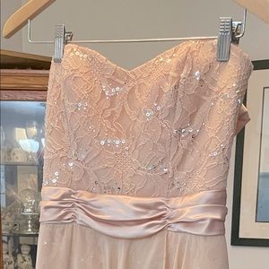 This is such a pretty light pink dress that is perfect for weddings and parties